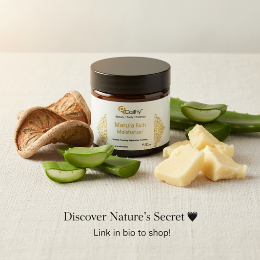 Caithy's Marula Rich Moisturiser jar with marula fruit and aloe vera on white linen